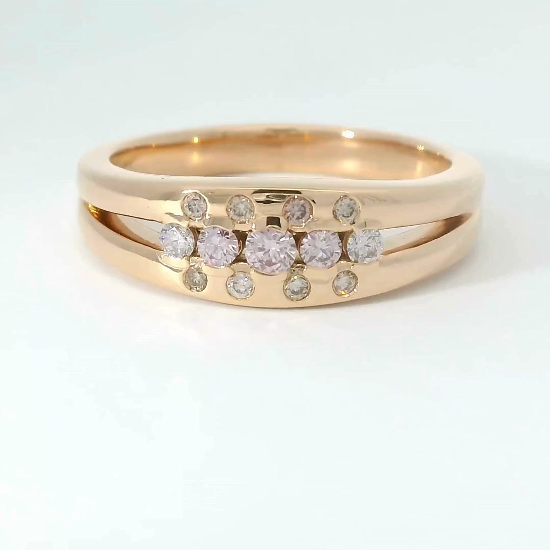 Custom rose-gold ring with pink diamonds, made by Regarde Jewellers using a client's stones.