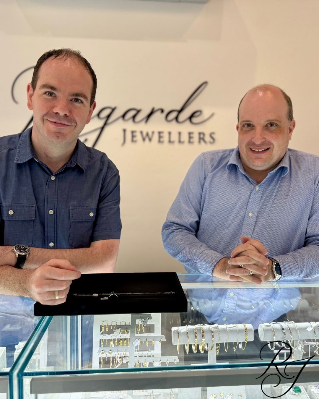 Jermaine and Richard behind the jewellery counter at Regarde Jewellers.